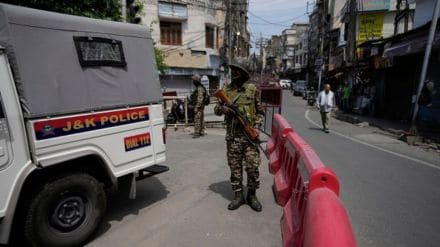 Security personnel at the site where a civilian was shot dead in Kupwara