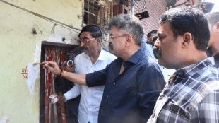 Thane Sharad Pawar group aggressive cluster scheme MLA Jitendra Awhad erased the cluster house numbers