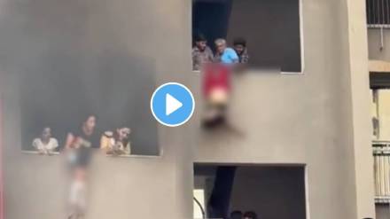 Ahmedabad Building Fire video A fire broke out in the Parishkar C Building Mother Bravely Climbs Down To Save Her Two Children