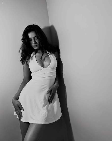 neha khan bold in sleeveless white dress