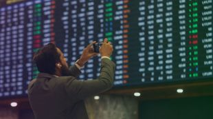 Stock traders monitor Sensex and Nifty as markets open with sharp gains