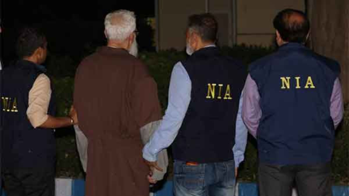 Tahawwur Rana being escorted by NIA officials outside the Special NIA Court