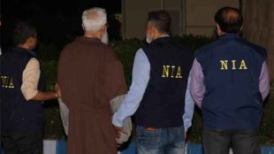 Tahawwur Rana being escorted by NIA officials outside the Special NIA Court