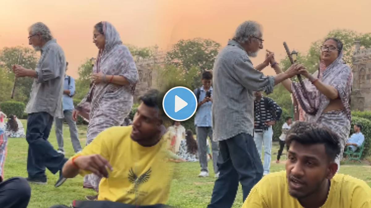 elderly couple dancing In garden On Romantic song