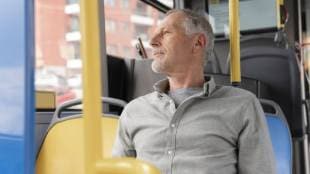 person give bus seat to an elderly man