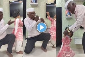 Old man dances joyfully with his granddaughter