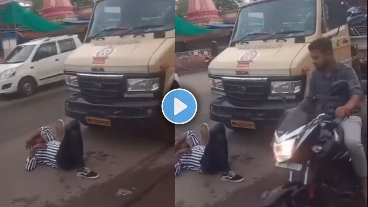 Biker lies down on road in front of towing vehicle – viral video from Alandi