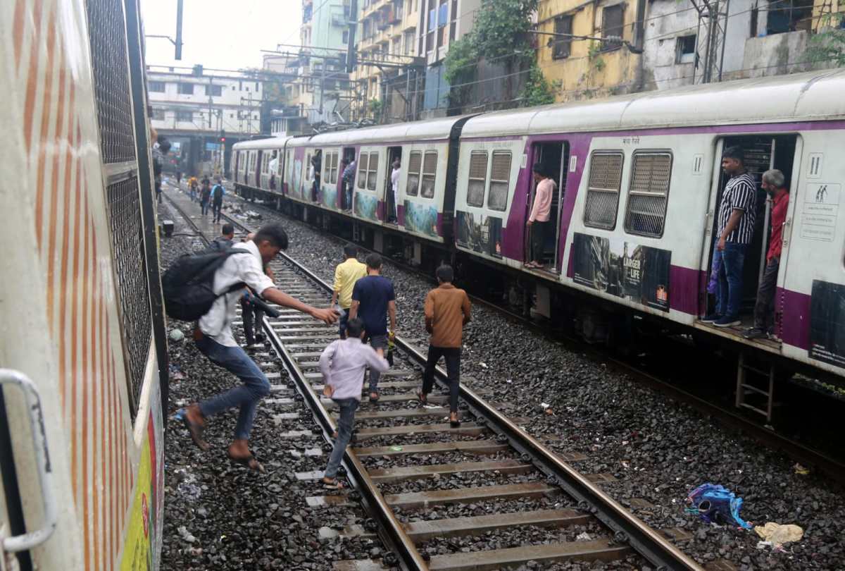 Heavy rains in Mumbai caused panic flooding traffic jams and major Central Railway disruption