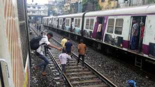 Heavy rains in Mumbai caused panic flooding traffic jams and major Central Railway disruption