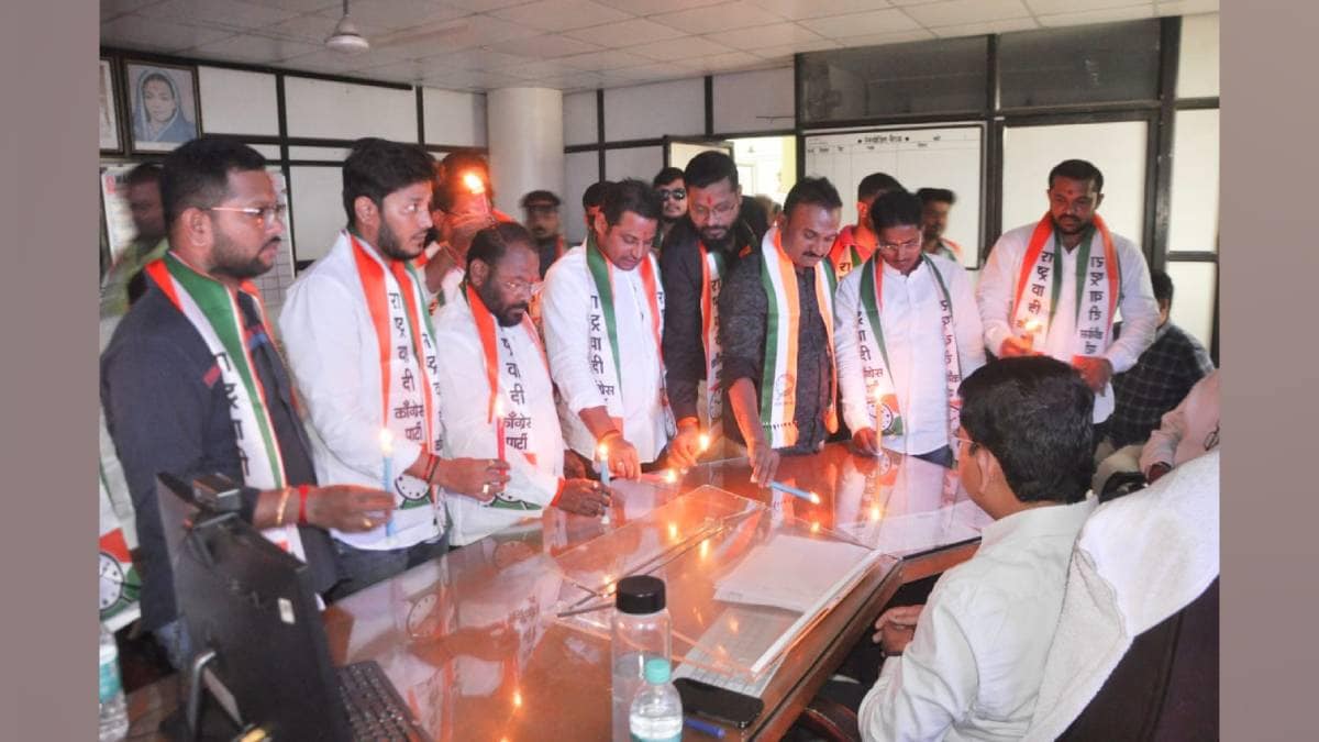 ncp ajit Pawar group protested outages by cutting Power lighting candles at Mahavitaran office