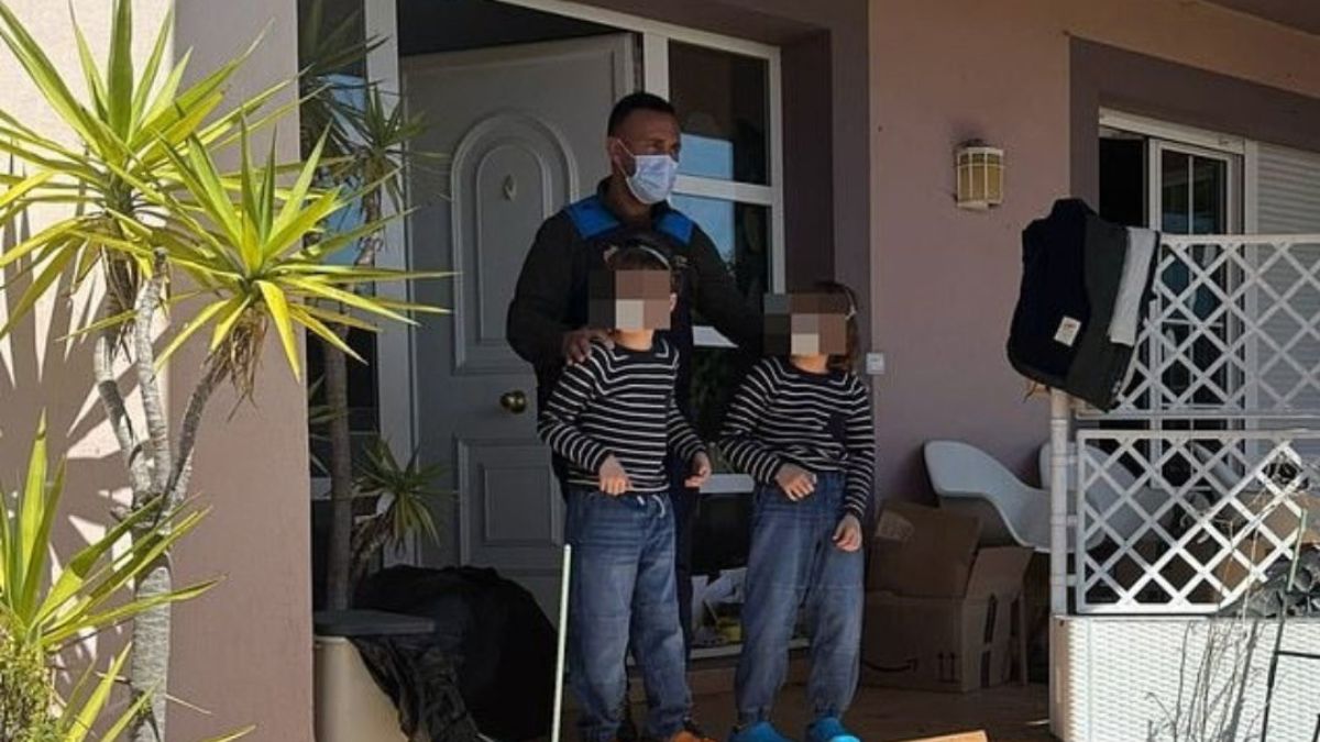 Child rescue officials at a rundown house after freeing children locked inside