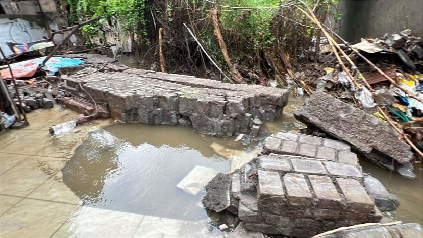 Retaining wall collapsed and the naullah water entered in to the shops and houses near Bishops school in Undri