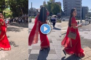 Indian girl wearing saree walking on a street in Japan