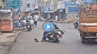 Andhra Man Drops Scooter Sleeps In The Middle Of Road In Vijayawada Video Goes Viral