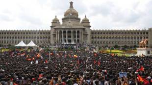 Some in the crowd climbed trees, while others found a way to the top of the Karnataka High Court building. (Express photo)