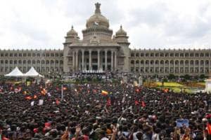 Some in the crowd climbed trees, while others found a way to the top of the Karnataka High Court building. (Express photo)