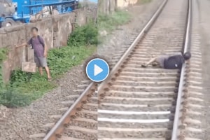 Shocking video of man sleeps on railway track motorman saves his life viral video on social media