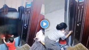 Video : Child's hand stuck in elevator door while mother is on mobile phone